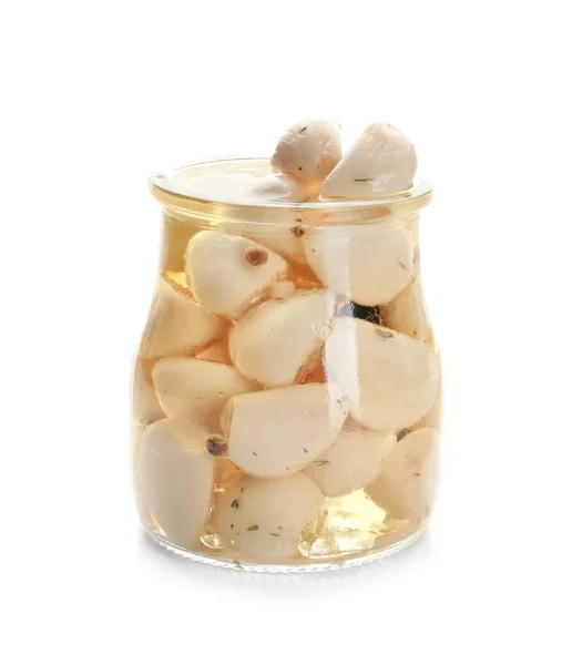 Preserved garlic in glass jar on white background — Stock Photo, Image