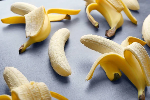 Ripe peeled bananas on table — Stock Photo, Image