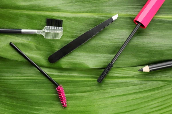 Tools for eyebrow dyeing and correction on green leaves