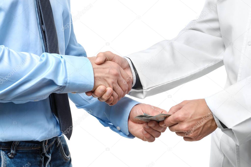 Doctor getting money from man on white background. Corruption concept