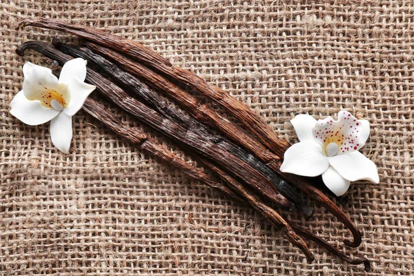 Vanilla Pinnar Och Blommor Säckväv Tyg — Stockfoto