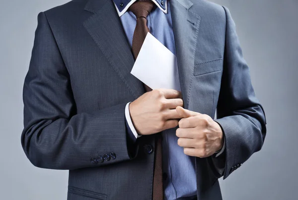 Empresario Poniendo Sobre Con Dinero Bolsillo Sobre Fondo Gris Concepto — Foto de Stock