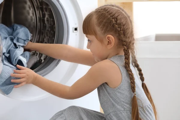 Cute Little Girl Doing Laundry Indoors — Stock Photo, Image