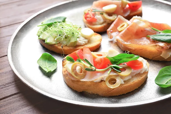 Tasty Bruschettas Prosciutto Olives Plate — Stock Photo, Image