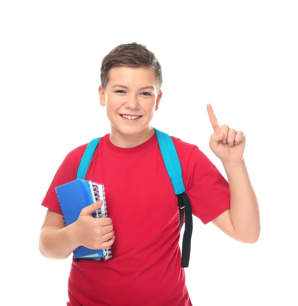 Teenage boy with backpack and notebooks on white background — Stock Photo, Image