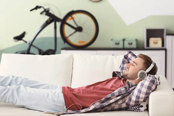 Young Man Listening Music While Relaxing Sofa Home — Stock Photo, Image