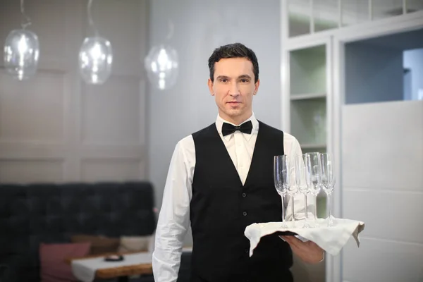 Young Waiter Holding Tray Glasses Indoors — Stock Photo, Image