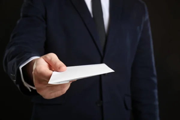 Businessman Holding Envelope Bribe Black Background — Stock Photo, Image