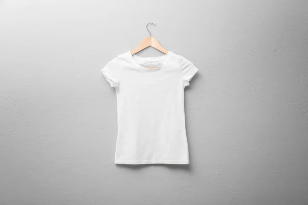 White t-shirt on light background. Mock up for design