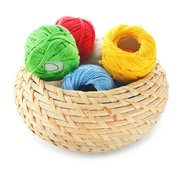 Wicker basket with colorful sewing threads — Stock Photo, Image