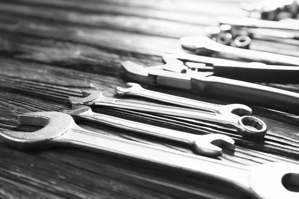 Plumber\'s tools on wooden background