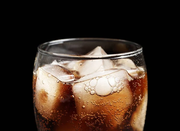 Glass of refreshing cola with ice on black background, closeup — Stock Photo, Image