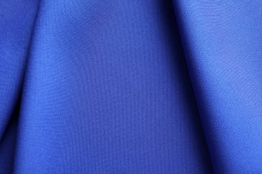 Kumaş dokulu arka plan olarak kıvrımlar ve