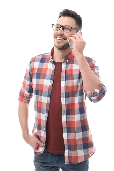 Jovem atraente falando no celular no fundo branco — Fotografia de Stock