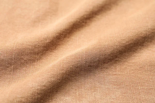 Текстура ткани со складками в качестве фона — стоковое фото