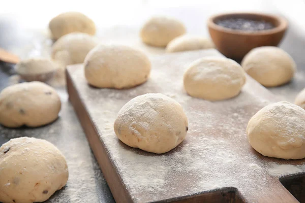 Unbaked buns of dough on table — Stock Photo, Image