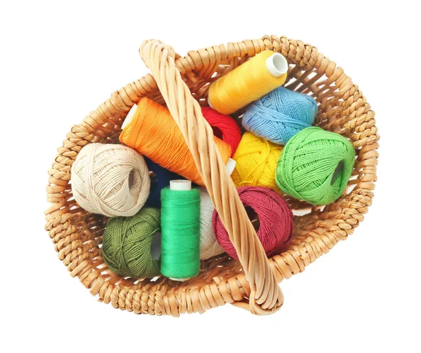 Wicker basket with colorful sewing threads — Stock Photo, Image