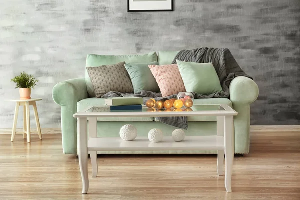 Comfortable mint sofa and table in living room — Stock Photo, Image