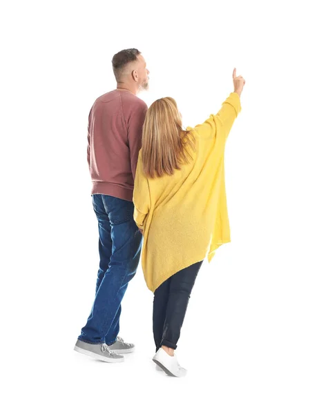 Mature couple in casual clothes walking on white background — Stock Photo, Image