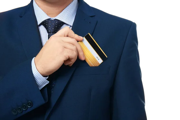 Hombre poniendo tarjeta de crédito en el bolsillo sobre fondo blanco — Foto de Stock