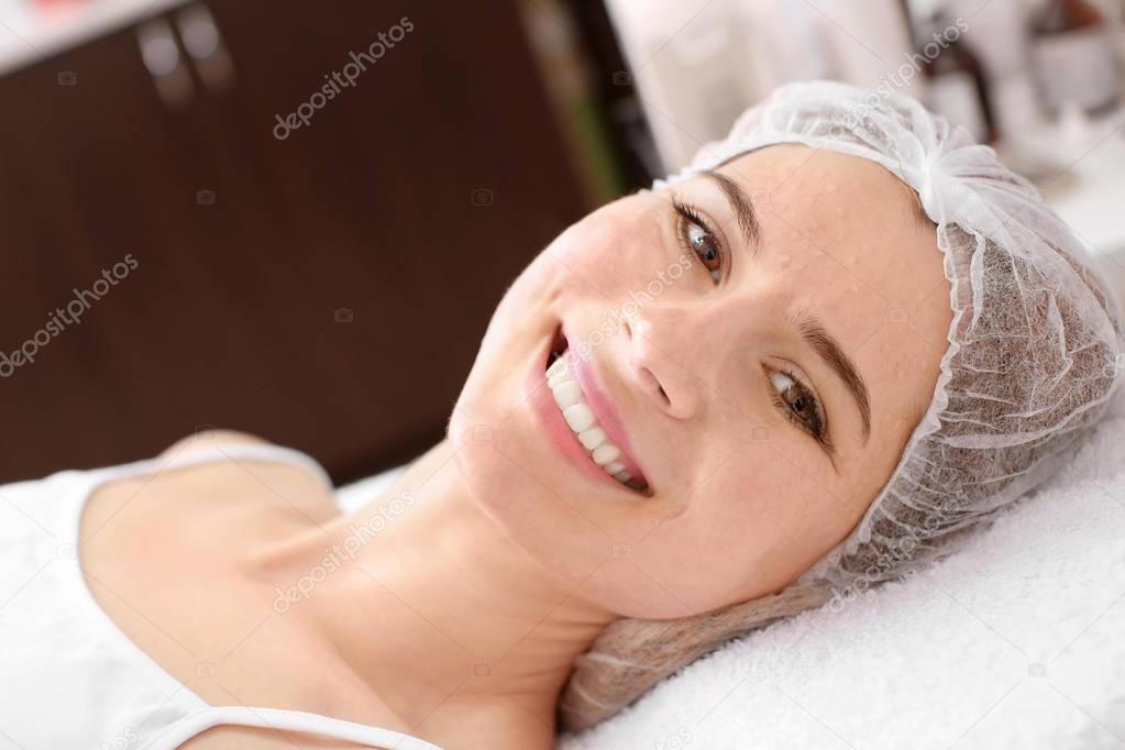 Young woman after biorevitalization procedure in salon