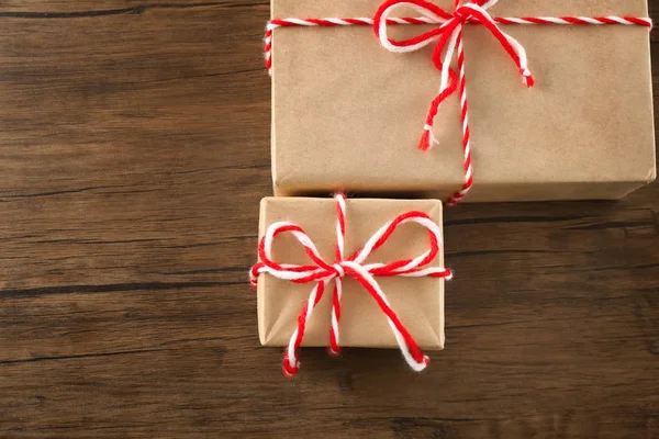 Parcel gift boxes on wooden table — Stock Photo, Image