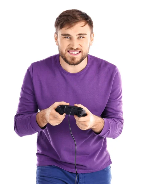 Hombre feliz con controlador de videojuegos sobre fondo blanco — Foto de Stock