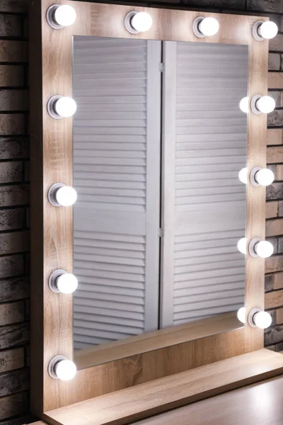 Mirror with lamps in modern makeup room — Stock Photo, Image