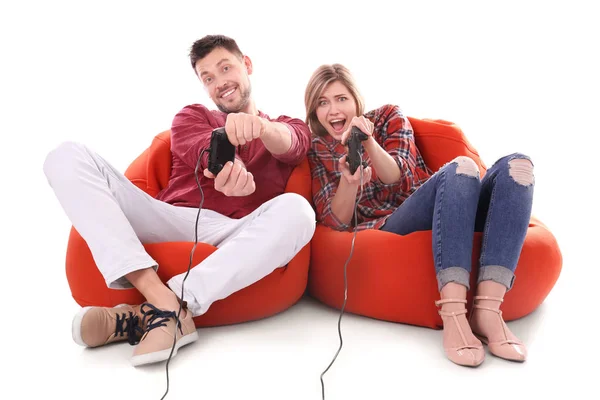 Casal emocional jogando videogame no fundo branco — Fotografia de Stock