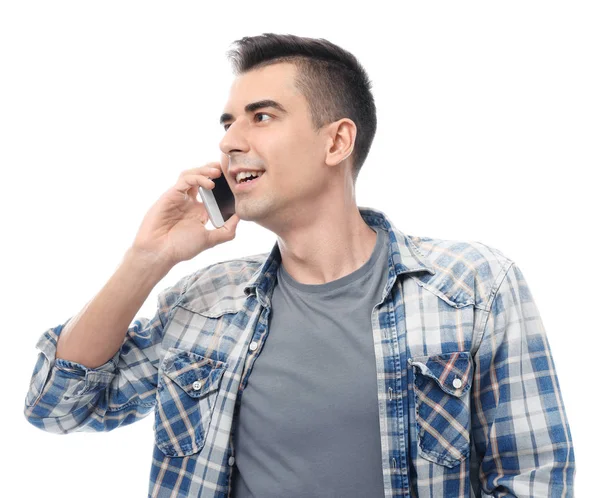 Jovem atraente falando no celular no fundo branco — Fotografia de Stock