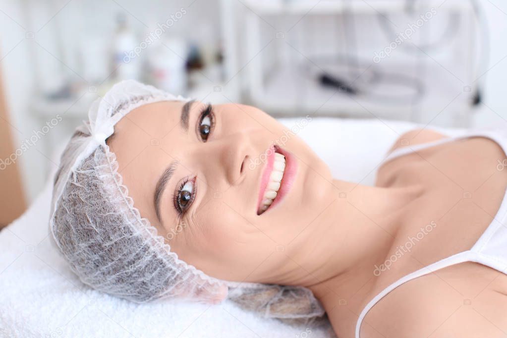 Young woman at beauty salon. Cosmetic procedures