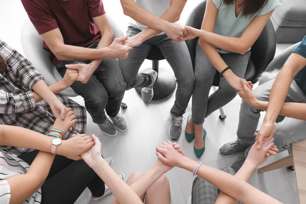 People holding hands together as symbol of unity — Stock Photo, Image