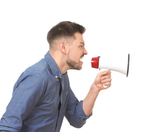 Angry man using megaphone against white background — Stock Photo, Image