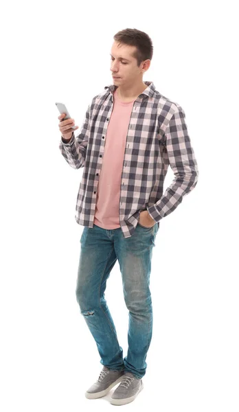 Beyaz arka plan üstünde hareket eden telefon ile çekici bir genç adam — Stok fotoğraf