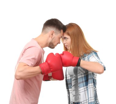 Angry couple in boxing gloves on white background clipart