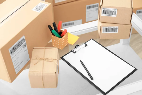Parcels ready for shipment to customers on table in home office. Startup business — Stock Photo, Image