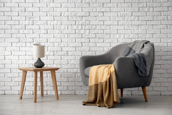 Elegant living room interior with comfortable armchair near wall — Stock Photo, Image