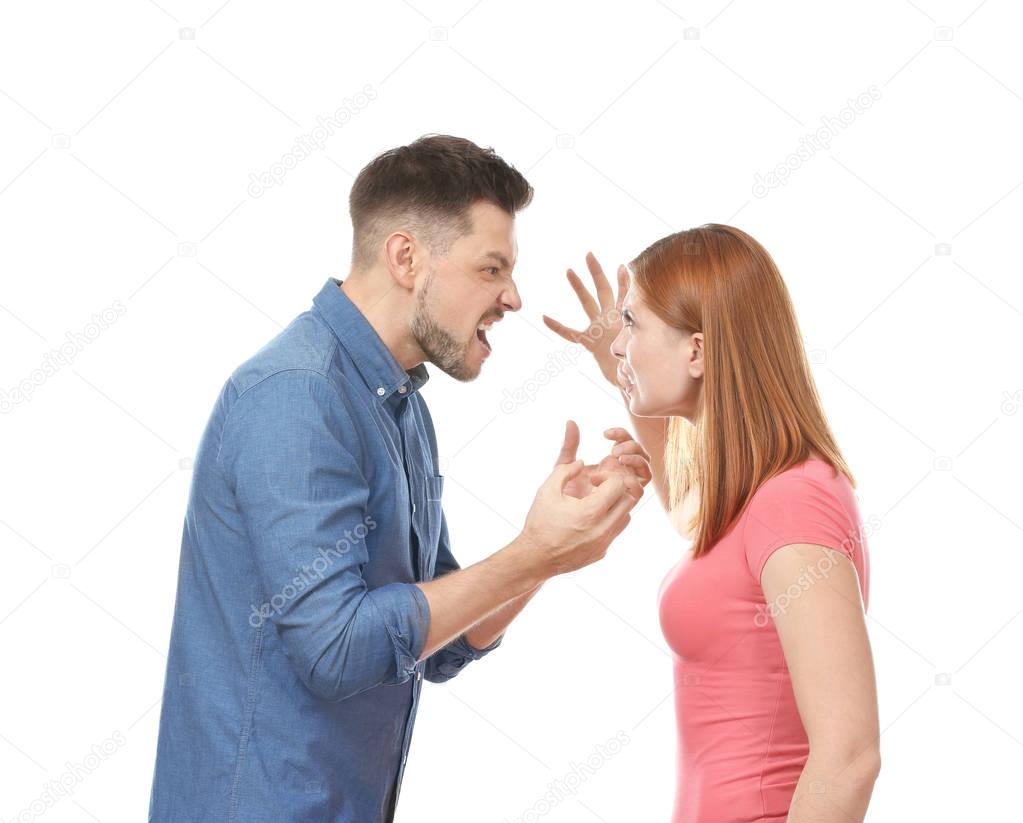 Emotional couple during quarrel on white background