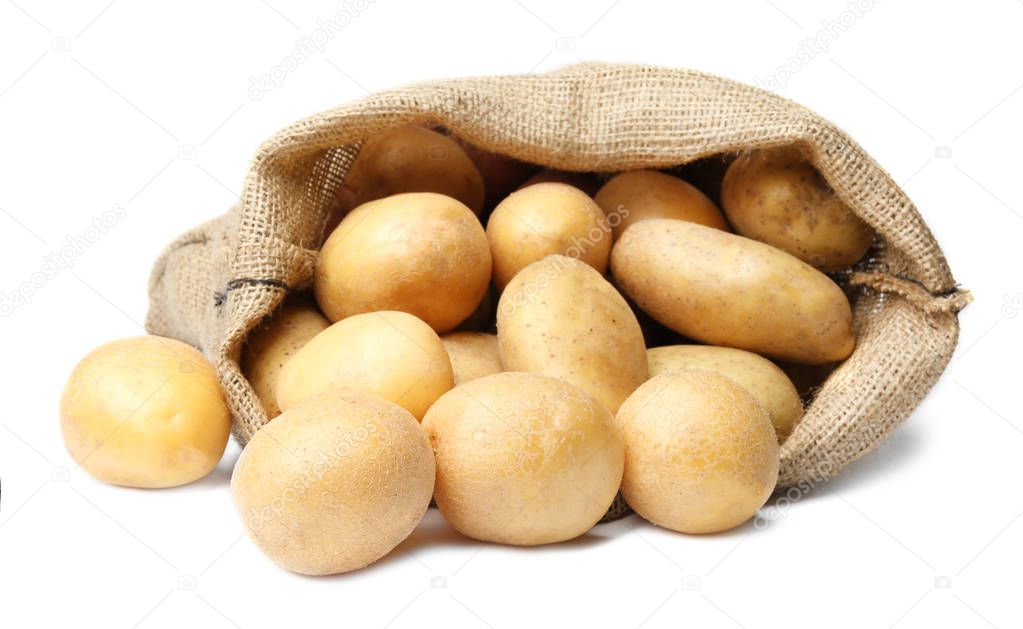 Sack of fresh raw potatoes on white background