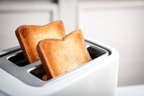 Preparing bread in toaster, closeup