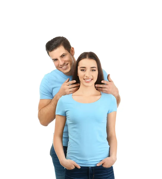 Jeune homme et femme en t-shirts élégants sur fond blanc. Maquette pour le design — Photo