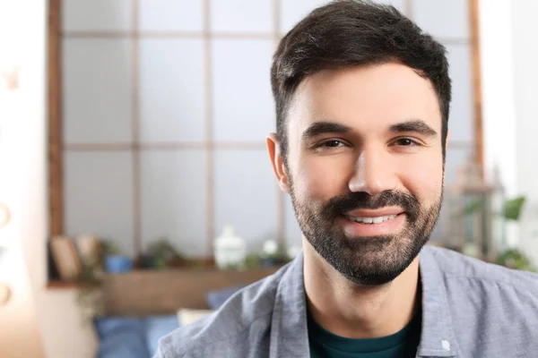 Young bearded man in casual clothes indoors — Stock Photo, Image