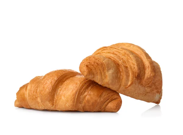 Leckere Croissants auf weißem Hintergrund — Stockfoto