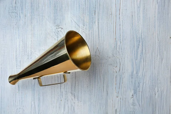 Vintage megaphone on wooden background — Stock Photo, Image