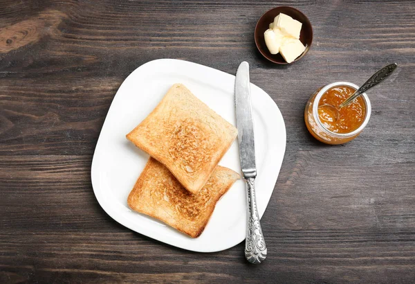 Plate with toasted bread on table — Stock Photo, Image