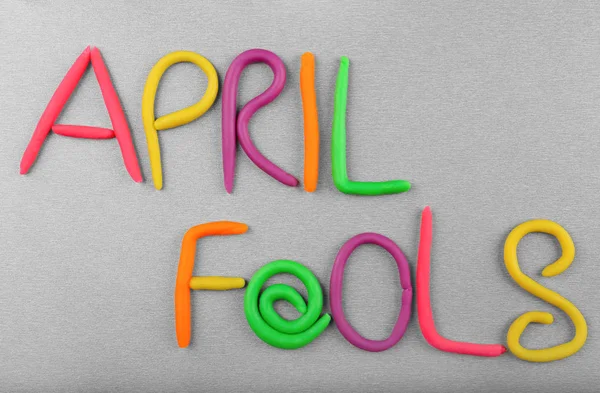 Phrase April Fools Made Plasticine Grey Background — Stock Photo, Image