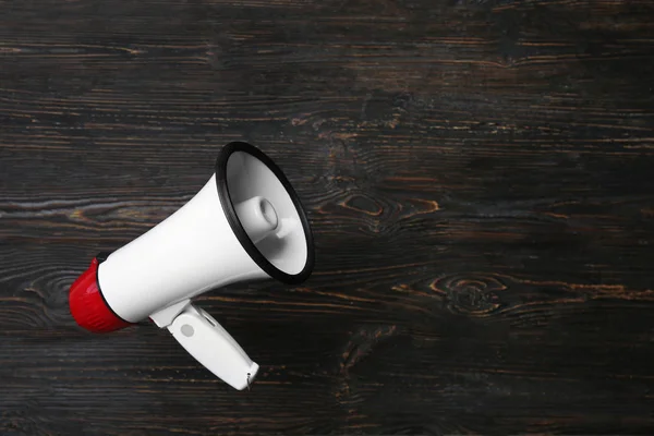 White megaphone on wooden background — Stock Photo, Image