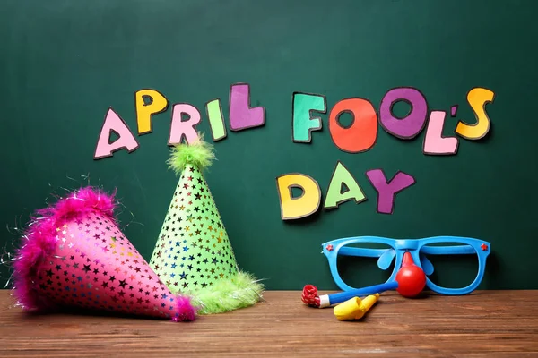 Party Caps Glasses Horns Table Chalkboard Phrase April Fools Day — Stock Photo, Image