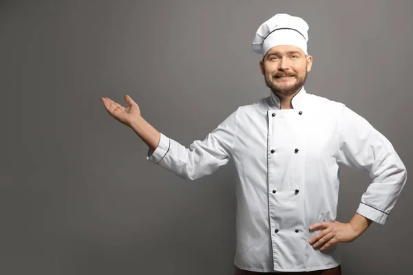 Handsome male chef on gray background — Stock Photo, Image