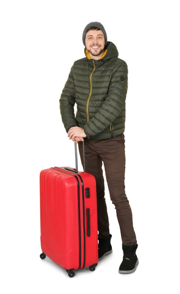 Młody człowiek w ciepłą odzież z bagażem na białym tle. Gotowy na zimowe wakacje — Zdjęcie stockowe